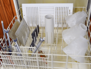A dishwasher stocked with cleaning supplies, perfect for apartments in Fayetteville NC