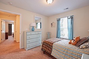 Two Bedroom Apartments in Fayetteville, NC - Model Bedroom with View to Hallway and Another Bedroom