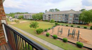 Apartments in Fayetteville, North Carolina - Balcony View of Playground and Green Space