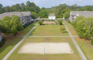 Apartments in Fayetteville, North Carolina - Outdoor Views of Green Space and Volleyball Court