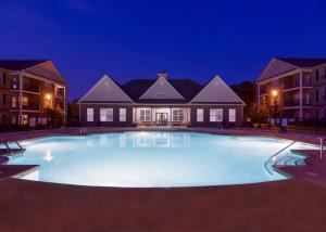  Apartments in Fayetteville, North Carolina - Pool, Patio and Clubhouse Lit Up at Night